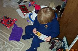 DCP_2323-Tyler-book reading on mini-chair.JPG